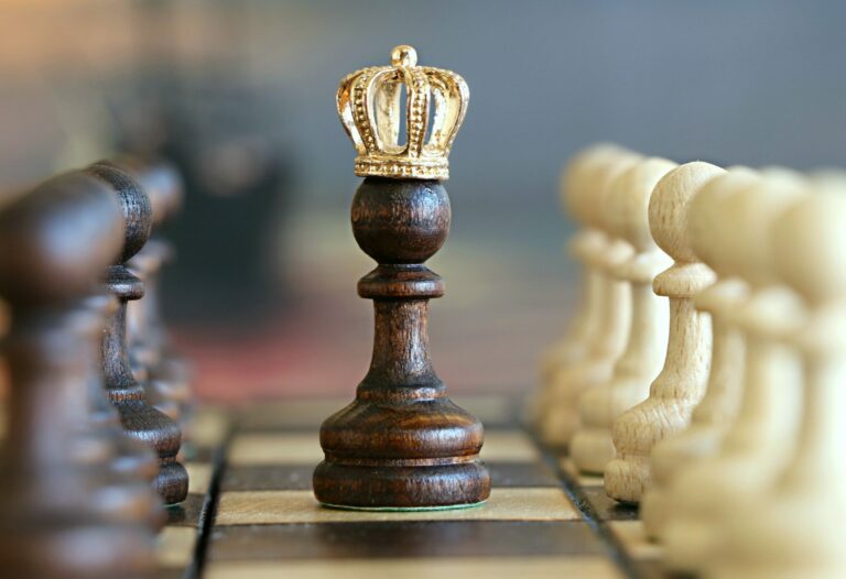 Chessboard with crowned pawn symbolizing growth, ambition, and leadership potential
