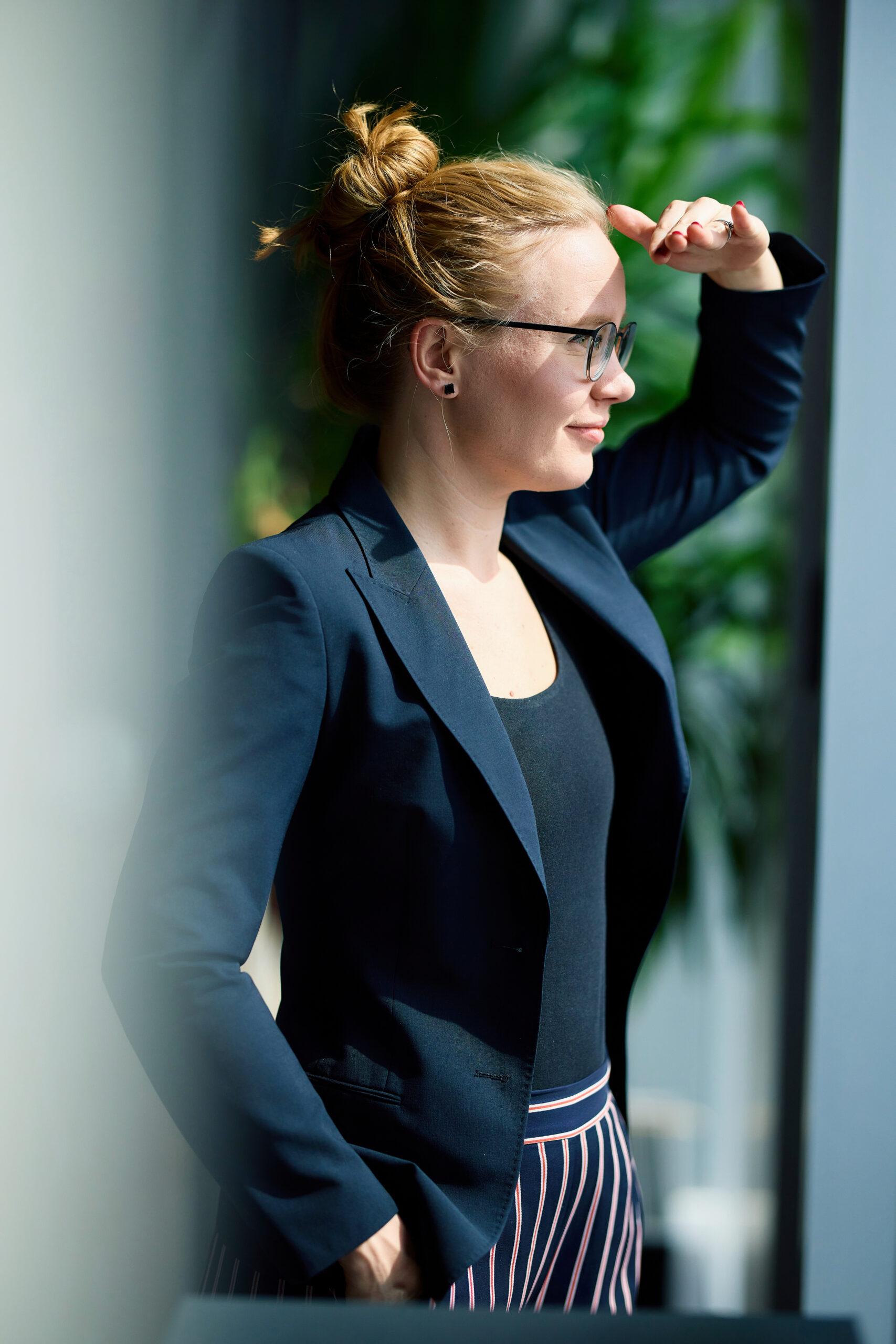 Mareike Walther upper-body portrait looking into the distance with a warm and approachable expression
